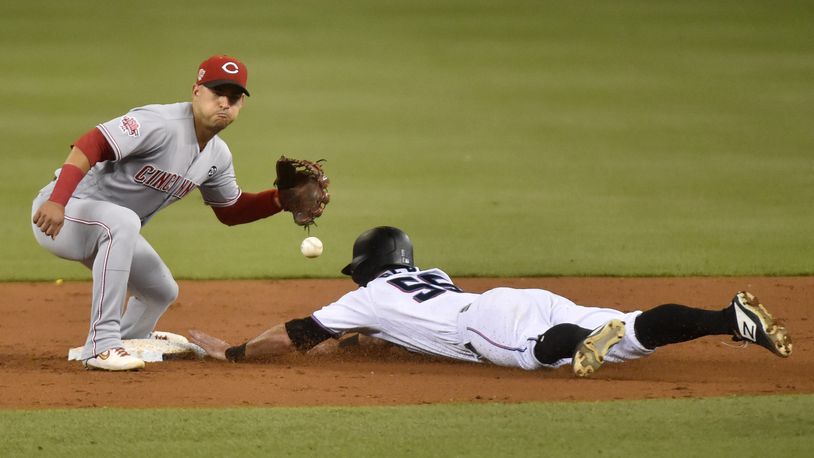 MIAMI, FL - AUGUST 26: Jon Berti #55 of the Miami Marlins steals second base during the third inning against the Cincinnati Reds at Marlins Park on August 26, 2019 in Miami, Florida. (Photo by Eric Espada/Getty Images)