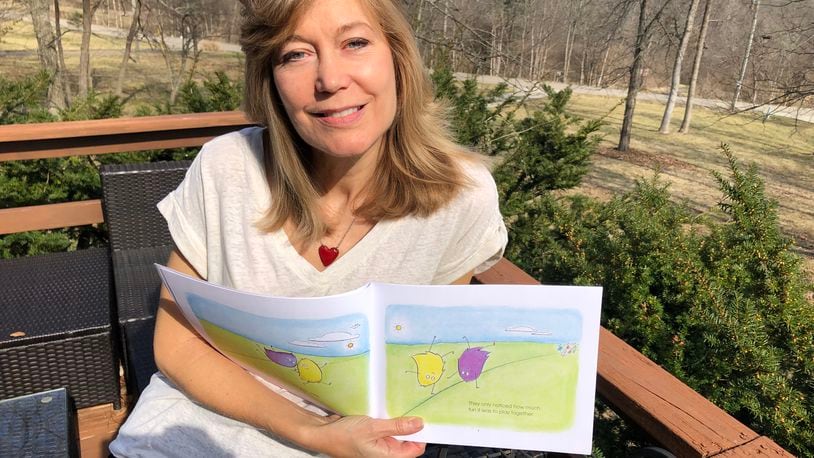 Marianne Reed recently released her first children's book, "The Boogies and the Woogies." She wrote and illustrated the 27-page book. RICK McCRABB/STAFF