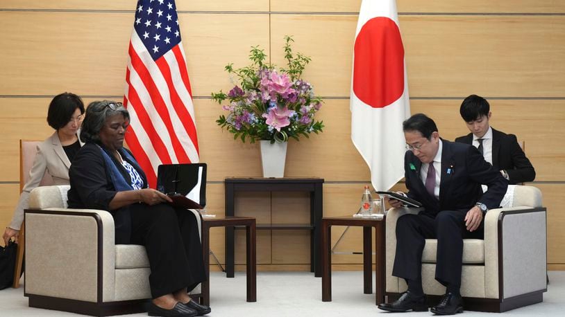 U.S. Ambassador to United Nations Linda Thomas-Greenfield, left, and Japan's Prime Minister Fumio Kishida, right, prepare to talk during a meeting Friday, April 19, 2024, at prime minister's office in Tokyo. (AP Photo/Eugene Hoshiko, Pool)