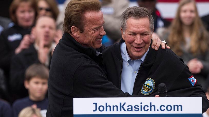 COLUMBUS, OH - MARCH 4: Ohio Republican Governor John Kasich is embraced by former California Governor Arnold Schwarzenegger before taking to the podium during a campaign rally at the Wells Barns at the Franklin Park Conservatory on March 6, 2016 in Columbus, Ohio. Arnold Schwarzenegger has endorsed Governor Kasich as the Republican Presidential candidate for the 2016 presidential election. (Photo by Ty Wright/Getty Images)