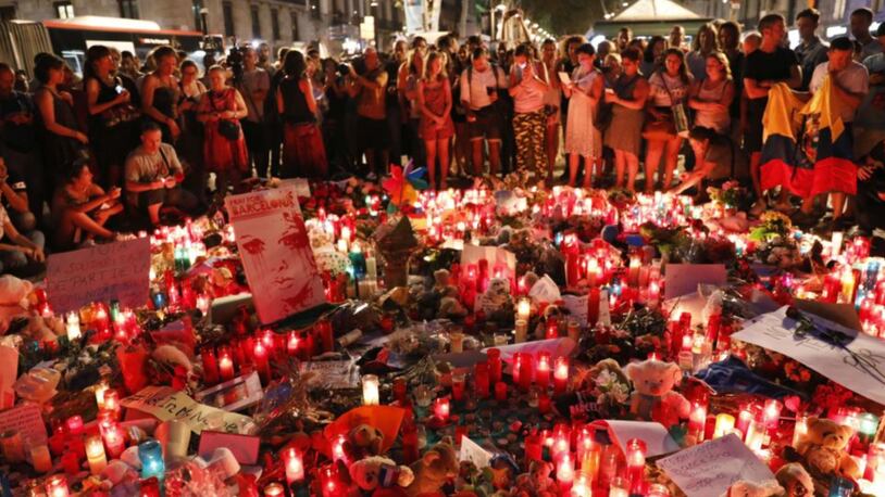 People gather on Las Ramblas in Barcelona on Friday to mourn the victims of the terrorist attack.