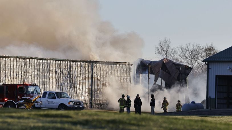 The Madison Twp. Fire Department and mutual aid departments are battling a fire this morning at Norvell's Turf Management Inc. on Elk Creek Road. NICK GRAHAM/STAFF
