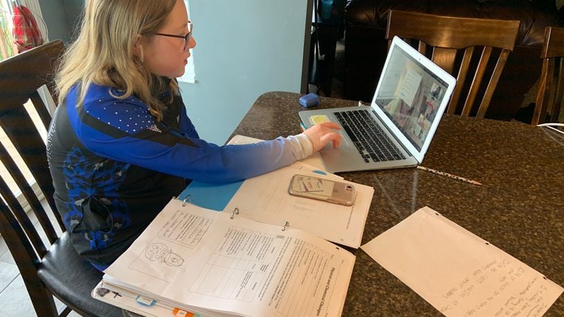 Like thousands of area families Gina Witko must soon decide whether to send her children to school under the threat of the coronavirus or have them learn - as her daughter pictured here - via virtual learning at home. The Fairfield school parent said she is "torn" about what is safest and best for her children.
(Provided Photo\Journal-News)