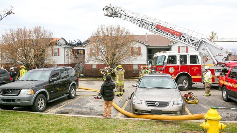 West Chester firefighters, shown fighting another recent fire at an apartment complex, battled a fire this morning that caused a portion of U.S. 42 to close down as they put out the blaze. GREG LYNCH/STAFF