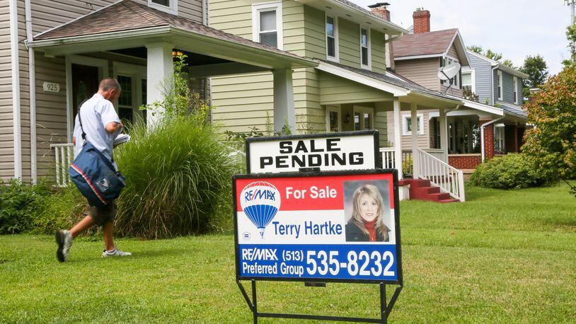 A home with a sale pending sign is seen Monday, Aug. 7, along Ridgelawn Avenue in Hamilton. Home sales, for Butler County and the region are continuing to hold steady through the first half of the year. GREG LYNCH / STAFF