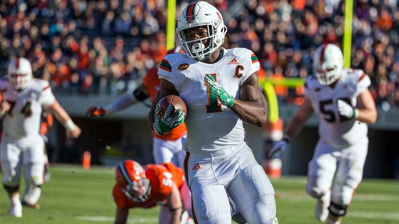 CHARLOTTESVILLE, VA - NOVEMBER 12: Mark Walton #1 of the Miami Hurricanes runs the ball during Miami’s game against the Virginia Cavaliers at Scott Stadium on November 12, 2016 in Charlottesville, Virginia. (Photo by Chet Strange/Getty Images)