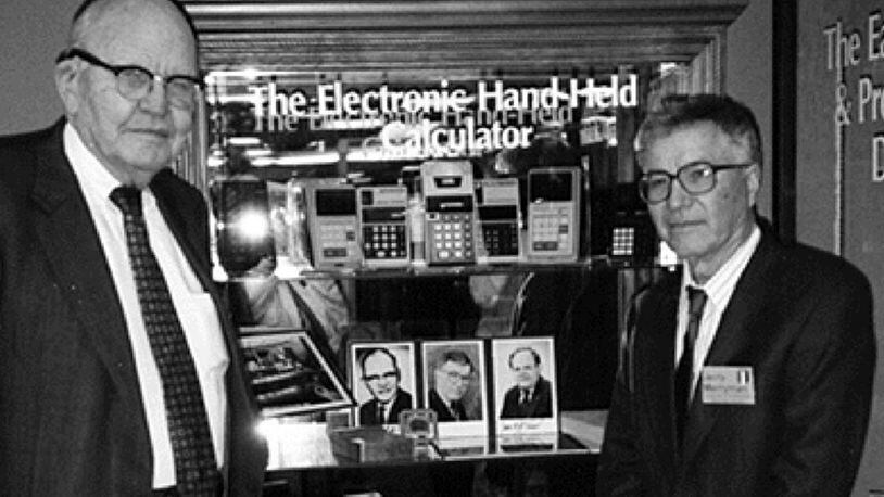 This 1997 photo taken by Phyllis Merryman shows Jack Kilby (left) and Jerry Merryman (right) at the American Computer Museum in Bozeman, Montana. Kilby, Merryman and James Van Tassel are credited with having invented the handheld calculator while working at Dallas-based Texas Instruments. Merryman died Feb. 27, 2019, at the age of 86.