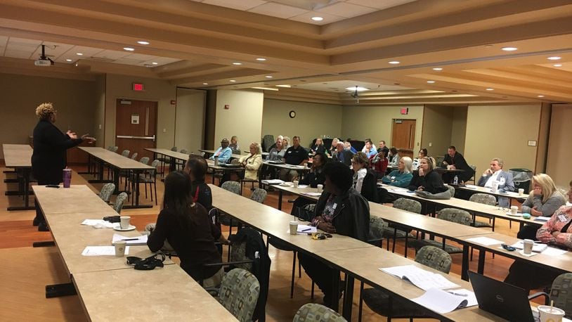 About 30 people attended the Community Health Partnership meeting Monday morning at Atrium Medical Center. La Shanda Sugg, owner of Labors of Love, a counseling and consulting company, was the keynote speaker. She talked about trauma and addiction. RICK McCRAB/STAFF