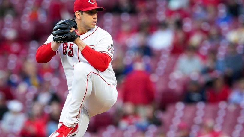 Cincinnati Reds relief pitcher Luis Cessa winds up during the first inning of the team's baseball game against the Chicago Cubs on Tuesday, Oct. 4, 2022, in Cincinnati. (AP Photo/Jeff Dean)