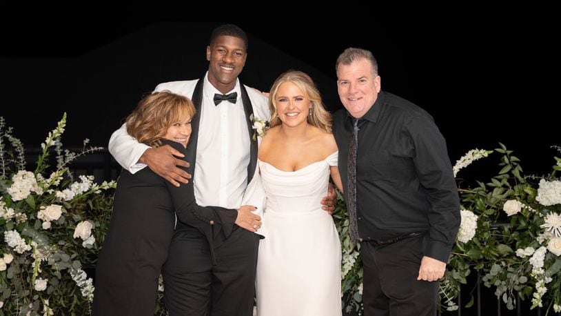 From left: Dulcie Martin, Chris Hudson, Catherine Hudson, Chuck Martin at the Hudson’s wedding on Rosemary Beach in Florida’s Panhandle last February. CONTRIBUTED