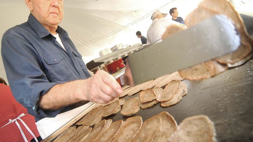 Gyros will be available for purchase at this weekend’s Greek Fest this weekend. FILE PHOTO Costa Sotiroglou flips the lamb meat for the Gryos being made for the 46th annual Greek Fest Saturday, July 27, 2013 in Middletown. Several Thousand people are expected to attend the three day annual event at Sts. Constantine and Helen Greek Orthodox Church. (CONTRIBUTED BY MARTIN WHEELER)
