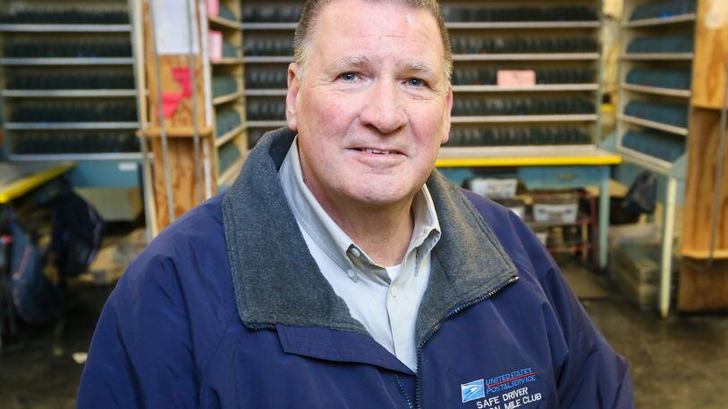 Hamilton mailman Ken Lipphardt, who last carried the mail on route 61, is retiring after 50 years of service. GREG LYNCH / STAFF