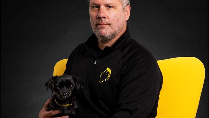 Thommy Long of LemonGrenade Creative has been named Hamilton's Small-Business Person of the Year, shown with his dog, Rae, named after the Star Wars character. He will be celebrated at Thursday evening's State of the City speech. PROVIDED