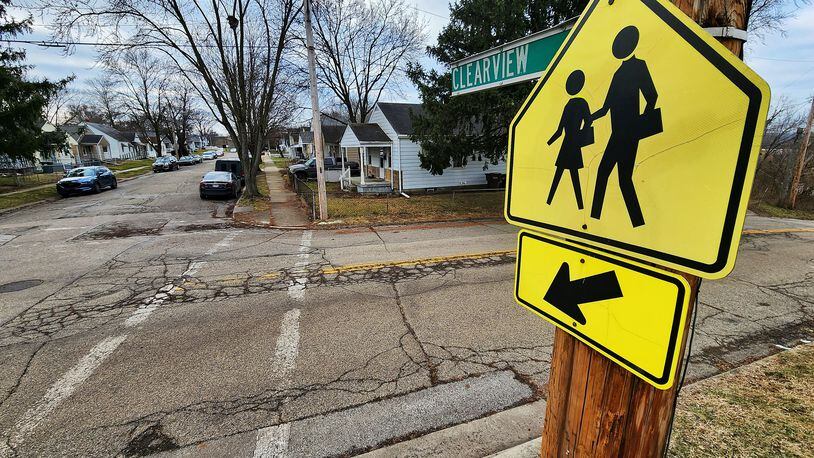 The city of Hamilton received a $250,000 Safe Routes to Schools grant from the Ohio Department of Transportation. It will install new sidewalks and ADA-compliant curb ramps, crosswalks, and signage around Crawford Woods Elementary School. NICK GRAHAM/FILE