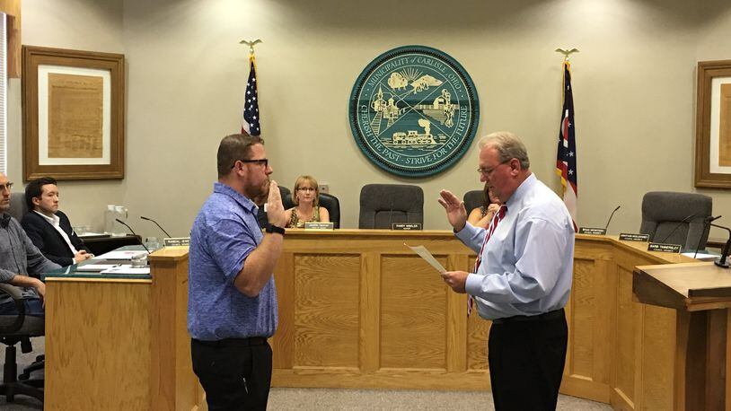 William Bicknell (left) is sworn-in by Carlisle Mayor Randy Winkler as a member of Carlisle Village Council on Sept. 12. Bicknell was appointed to complete the unexpired term of Councilman Jake Fryman, who resigned effective Sept. 16. Bicknell is one of five people seeking one of the four open seats on council this fall. CONTRIBUTED