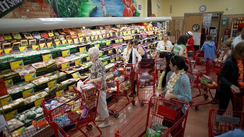 Shoppers at a Florida Trader Joe's. The grocery chain is is reducing plastic packaging for its products as part of sustainability efforts.