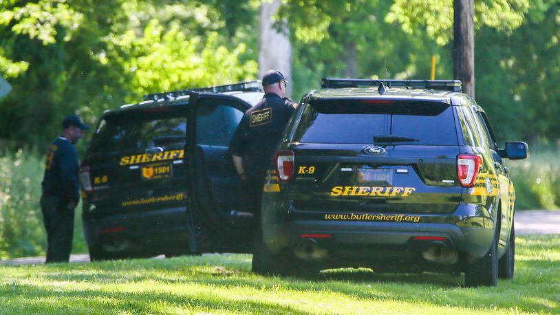 Investigators from the Butler County Sheriff's Office conducted a "secondary search" Tuesday May 30, at the scene of a fatal shooting in the 500 block of Warwick Road in St. Clair Twp. GREG LYNCH / STAFF