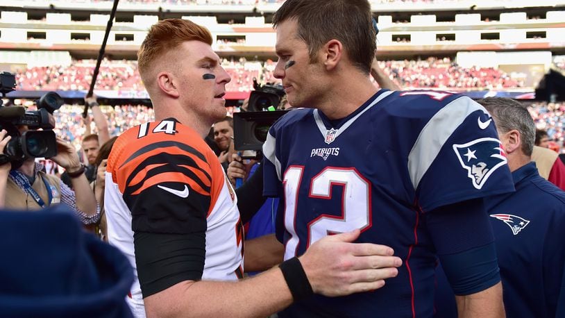 FOXBORO, MA - OCTOBER 16:  Tom Brady #12 of the New England Patriots reacts with Andy Dalton #14 of the Cincinnati Bengals following a game against the Cincinnati Bengals at Gillette Stadium on October 16, 2016 in Foxboro, Massachusetts.  (Photo by Billie Weiss/Getty Images)