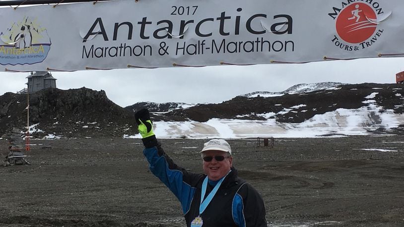 Frank Williams, then 70, stands at the finish line of his Antarctica race. CONTRIBUTED