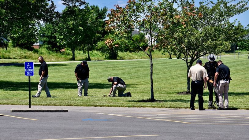 Investigators search Liberty Park in Liberty Twp. for evidence following a fatal shooting there on Wednesday night, June 10, 2020. NICK GRAHAM / STAFF