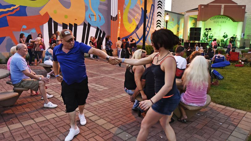 David Skaggs and Victoria Morris dance to the music of the Nick Netherton Band during last year’s first Broad Street Bash in Middletown. NICK GRAHAM/STAFF