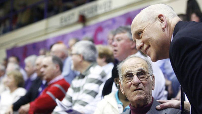 Former Middletown principal Dennis Newell talks to Jerry Nardiello during the Middletown Middies game against Hamilton in 2009 at Wade E. Miller Gymnasium in Middletown. Nardiello were there when the school retired the jersey of Jerry Lucas. FILE PHOTO