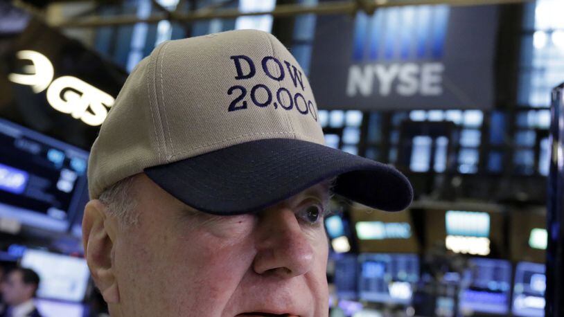 Arthur Cashin, director of floor operations for UBS Financial Services at the New York Stock Exchange, wears a Dow 20,000 hat, Wednesday, Jan. 25, 2017. The Dow Jones industrial average is trading over 20,000 points for the first time, the latest milestone in a record-setting drive for the stock market. The market has been marching steadily higher since bottoming out in March 2009 in the aftermath of the financial crisis. (AP Photo/Richard Drew)