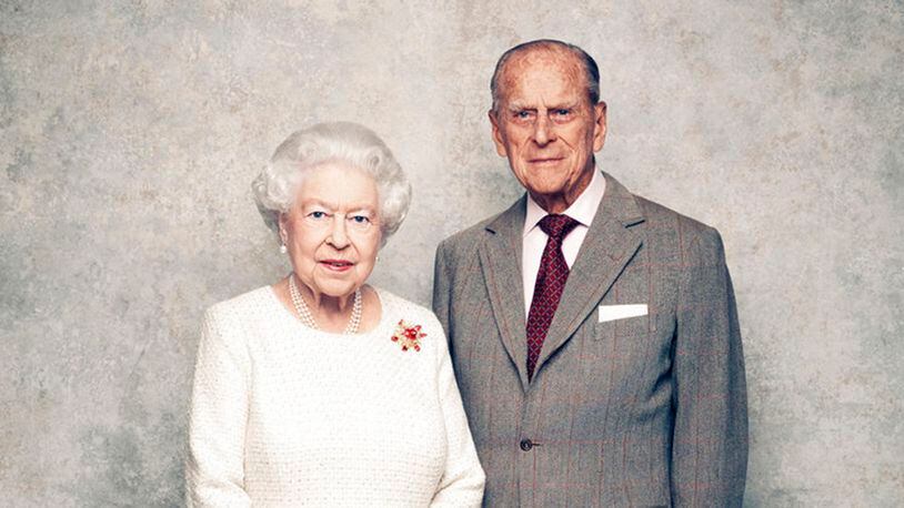 In this handout photo issued by Camera Press and taken in Nov. 2017, Britain's Queen Elizabeth and Prince Philip pose for a photograph in the White Drawing Room pictured against a platinum-textured backdrop at Windsor Castle, England. Britainâs Queen Elizabeth II and Prince Philip are marking 70 years since they wed in Londonâs Westminster Abbey. At the time, Princess Elizabeth was just 21 and Philip, a naval officer, was 26. Their wedding was a spark of joy and celebration in a country just recovering from World War II.