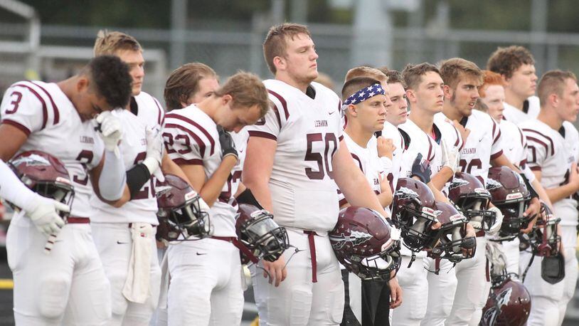 Lebanon lines up for the national anthem before a game against Springfield on Friday, Sept. 21, 2018, at Evans Stadium in Springfield. David Jablonski/Staff