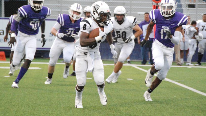 Lakota East’s Donny Wilkinson (8) is chased by Middletown’s Kenny Wilson (17) during a game earlier this season at Barnitz Stadium in Middletown. East won the Greater Miami Conference opener 32-7. CONTRIBUTED PHOTO BY OLIVER SANDERS