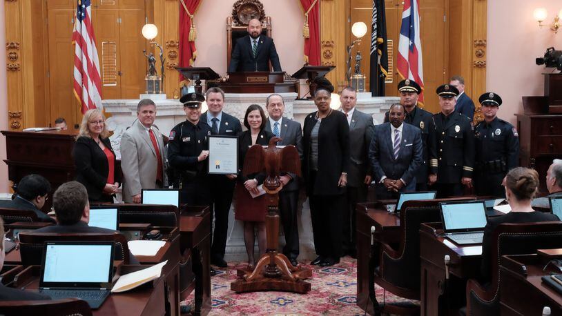 The Ohio House of Representatives on Wednesday, June 21, 2017, honored Ohio State University police officer Alan Horujko (holding resolution) for his actions during the fall 2016 campus attack. CONTRIBUTED
