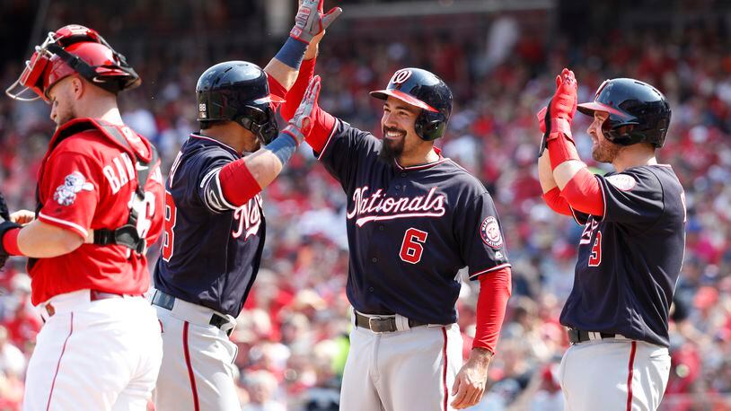 CINCINNATI, OH - JUNE 01: Gerardo Parra #88 of the Washington Nationals is congratulated by Anthony Rendon #6 and Brian Dozier #9 after hitting a three-run home run in the second inning against the Cincinnati Reds at Great American Ball Park on June 1, 2019 in Cincinnati, Ohio. (Photo by Joe Robbins/Getty Images)