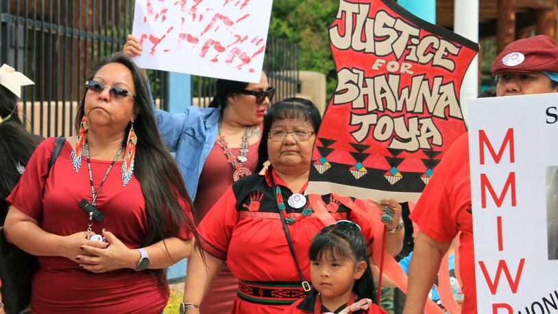 Geraldine Toya, center, marches to bring awareness to the death of her daughter Shawna Toya, in 2021, as dozens of people participate in Missing and Murdered Indigenous Persons Awareness Day in Albuquerque, N.M., Sunday, May 5, 2024. (AP Photo/Susan Montoya Bryan)