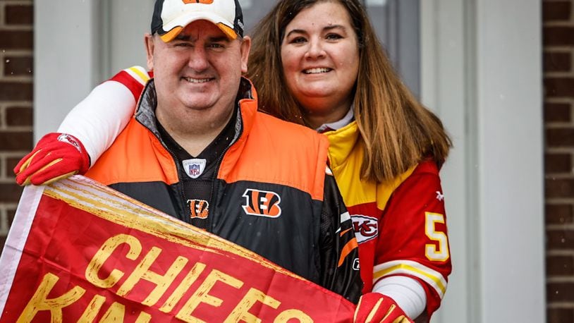 Kathy Ann is a Chiefs fan and Mike Mossbarger is a Bengals fan. Both will be cheering for their teams this Sunday.  “I’m originally from Kansas City, that’s where I was born and raised,” said Kathy Ann, who is the Chiefs fan in their household. Mike is a lifelong Bengals fan having grown up around his father’s and grandfather’s love of the team. JIM NOELKER/STAFF
