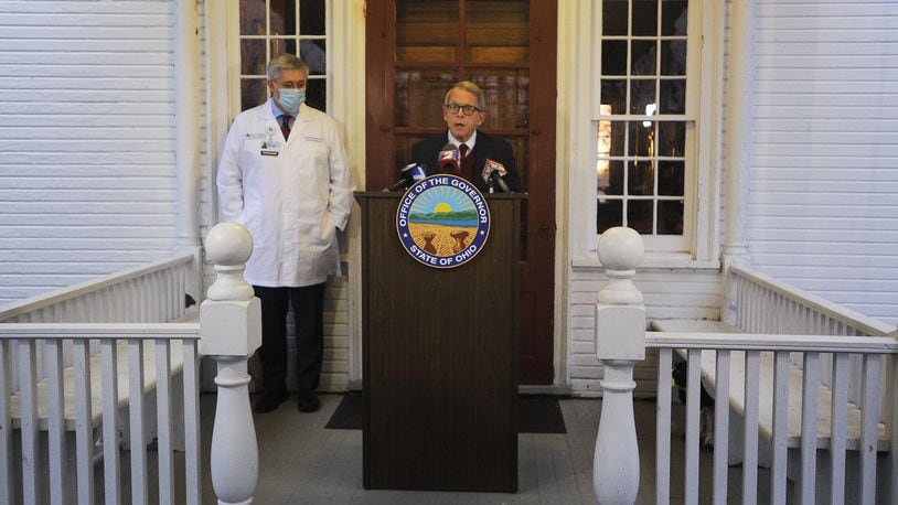 Ohio Governor Mike DeWine along with Kevin Sharrett, MD, held a press conference at the governor's home early Wednesday morning. MARSHALL GORBY\STAFF