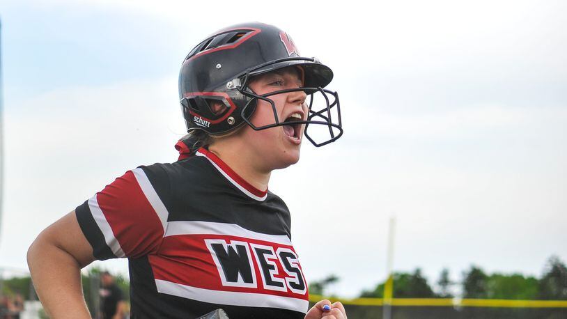 Lakota West’s Corey Weaver celebrates a run during a Division I district softball final against Fairfield on Friday at Lakota East. West won 8-2. NICK GRAHAM/STAFF