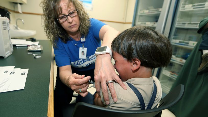 A registered nurse and immunization outreach coordinator with the Knox County Health Department, administers a vaccination to a kid at the facility in Mount Vernon, Ohio, Friday May 17, 2019. In a report issued Wednesday, Nov. 23, 2022, the World Health Organization and the U.S. Centers for Disease Control and Prevention say measles immunization has dropped significantly since the coronavirus pandemic began, resulting in a record high of nearly 40 million children missing a vaccine dose last year. (AP Photo/Paul Vernon, File)