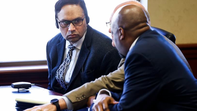 Gurpreet Singh, left, accused of a quadruple homicide in 2019, sits with his new attorneys Jeremy Evans, middle, and David Washington, right, during a pretrial hearing in Butler County Common Pleas Court Wednesday, Nov. 9, 2022 in Hamilton. Singh's first trial was held last month but the jury was unable to reach a verdict. A new pretrial date is scheduled for Jan. 11, 2023. NICK GRAHAM/STAFF NICK GRAHAM/STAFF