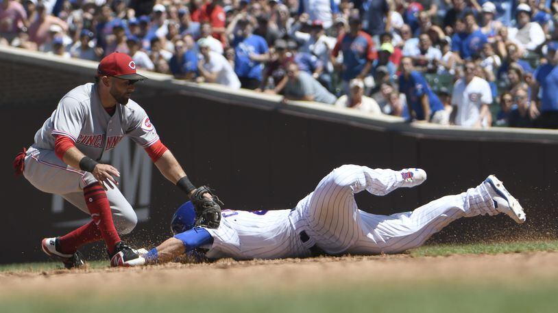 CHICAGO, IL - JULY 08:Jose Peraza #9 of the Cincinnati Reds tags out Willson Contreras #40 of the Chicago Cubs at second base during the third inning on July 8, 2018 at Wrigley Field  in Chicago, Illinois. (Photo by David Banks/Getty Images)