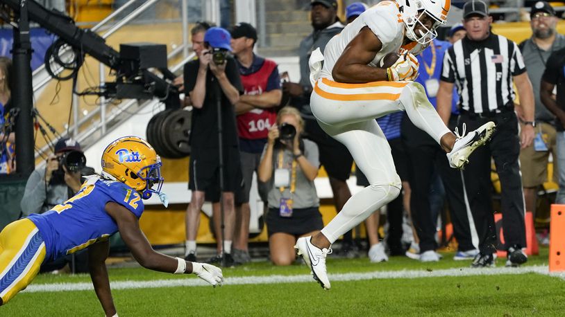Tennessee wide receiver Cedric Tillman makes a catch for a touchdown in front of Pittsburgh defensive back M.J. Devonshire during overtime of an NCAA college football game, Saturday, Sept. 10, 2022, in Pittsburgh. Tennessee won 34-27. (AP Photo/Keith Srakocic)