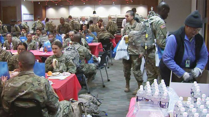 Thousands of soldiers fed by volunteers as they head home for the holidays at Charlotte Douglas.