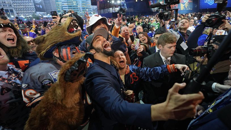 Southern California quarterback Caleb Williams celebrates after being chosen by the Chicago Bears with the first overall pick during the first round of the NFL football draft, Thursday, April 25, 2024, in Detroit. (AP Photo/Paul Sancya)