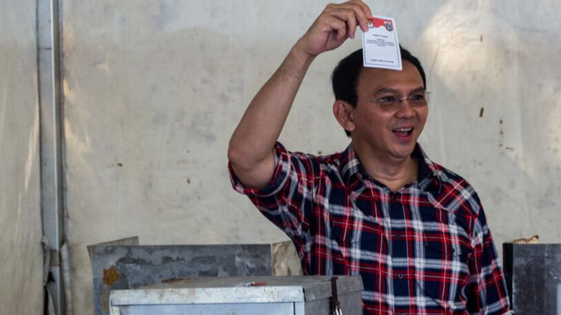 JAKARTA, INDONESIA - FEBRUARY 15:  Basuki Tjahaja Purnama shows his ballot after voting in the Jakarta Governal Election on February 15, 2017 in Jakarta, Indonesia. Residents of Indonesia's capital went to the polls on Wednesday to vote for its new governor during an election marked by mass demonstrations against the incumbent governor Basuki Purnama Tjahaja, also known as Ahok, who became embroiled in a blasphemy scandal after being accused of insulting Islam.  (Photo by Oscar Siagian/Getty Images)
