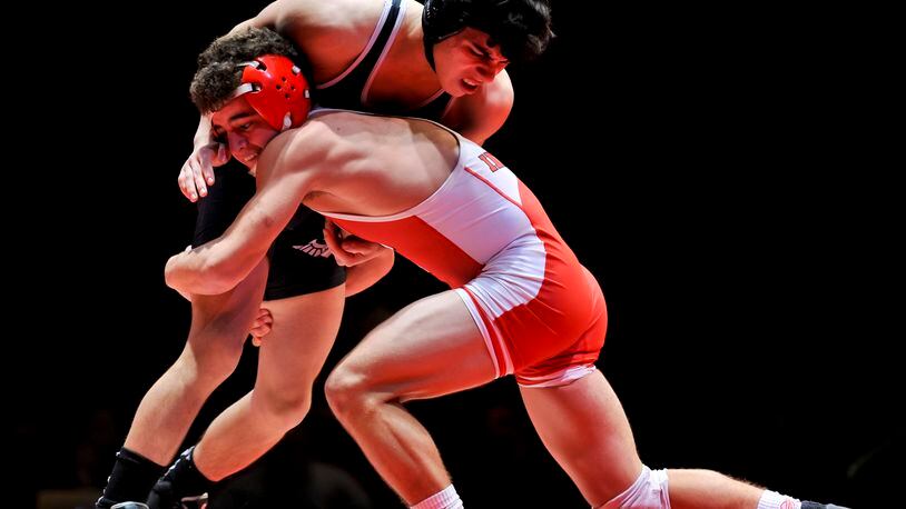 Fairfield’s Zach Shupp (right) competes against Lakota East’s Christian Chavez during a dual match Jan. 14, 2016, at Fairfield High School’s Performing Arts Center. NICK GRAHAM/STAFF