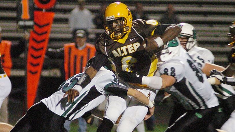 Alter’s quarter back Malik Zaire (6) rushing through Badin’s defensive line at Centerville’s football stadium Friday evening. Contributed Photo by Charles Caperton