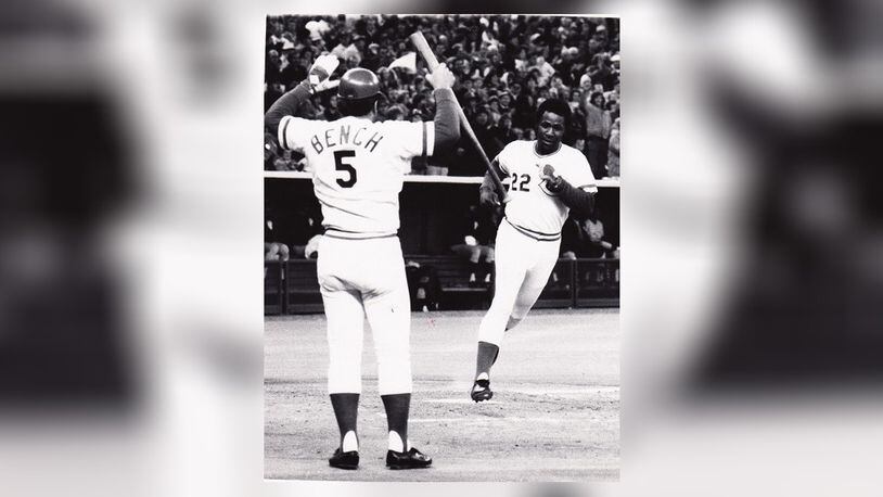 Johnny Bench is there to greet Dan Driessen after he scores a run during the 1976 World Series. DDN FILE