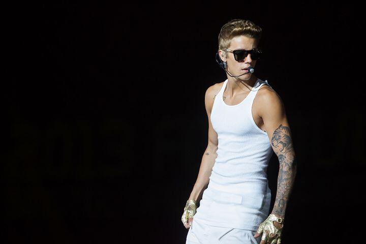 Justin Bieber was caught lip-syncing during a 2012 show in Arizona when his vocals continued while he threw up onstage. A music critic also accused him of lip-syncing during a 2013 New Jersey show.