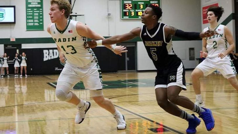 Badin’s Justin Pappas (13) and Northwest’s Dae’Mon Cherry (5) go after the ball Tuesday night at Mulcahey Gym in Hamilton. Badin won 70-52. CONTRIBUTED PHOTO BY TERRI ADAMS
