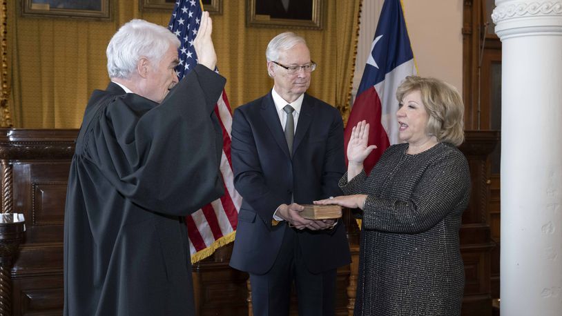Former Texas Sen. Jane Nelson, of Flower Mound, is sworn in as the 115th Secretary of State by Chief Justice Nathan Hecht in the Supreme Court room at the Texas Capitol.  Her husband, J. Michael Nelson, holds a bible during the ceremony. CREDIT: Bob Daemmrich/for the Texas Secretary of State's Office