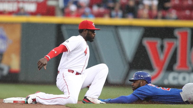 The Cubs’ Jason Heyward steals second just ahead of the tag by the Reds second baseman Brandon Phillips on Friday, April 22, 2016, at Great American Ball Park in Cincinnati. David Jablonski/Staff»